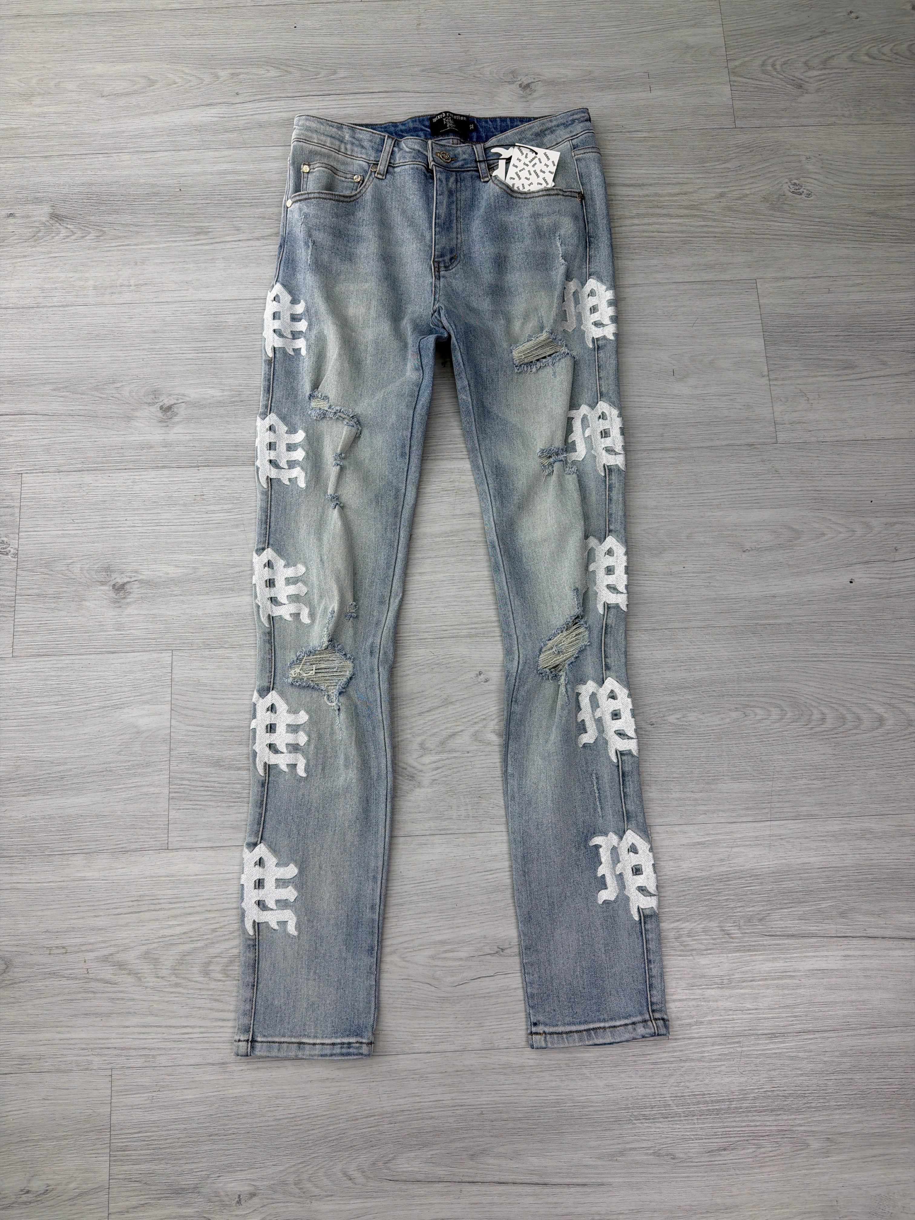 Mixed Emotions blue and white side logo jeans